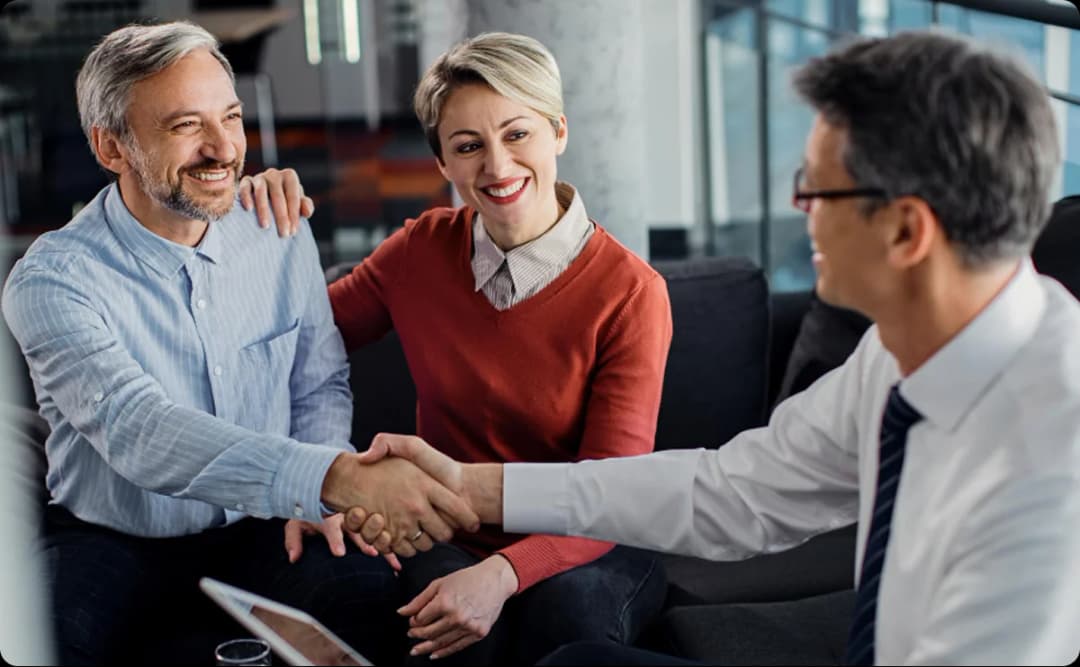 Business professionals shaking hands in consultation meeting